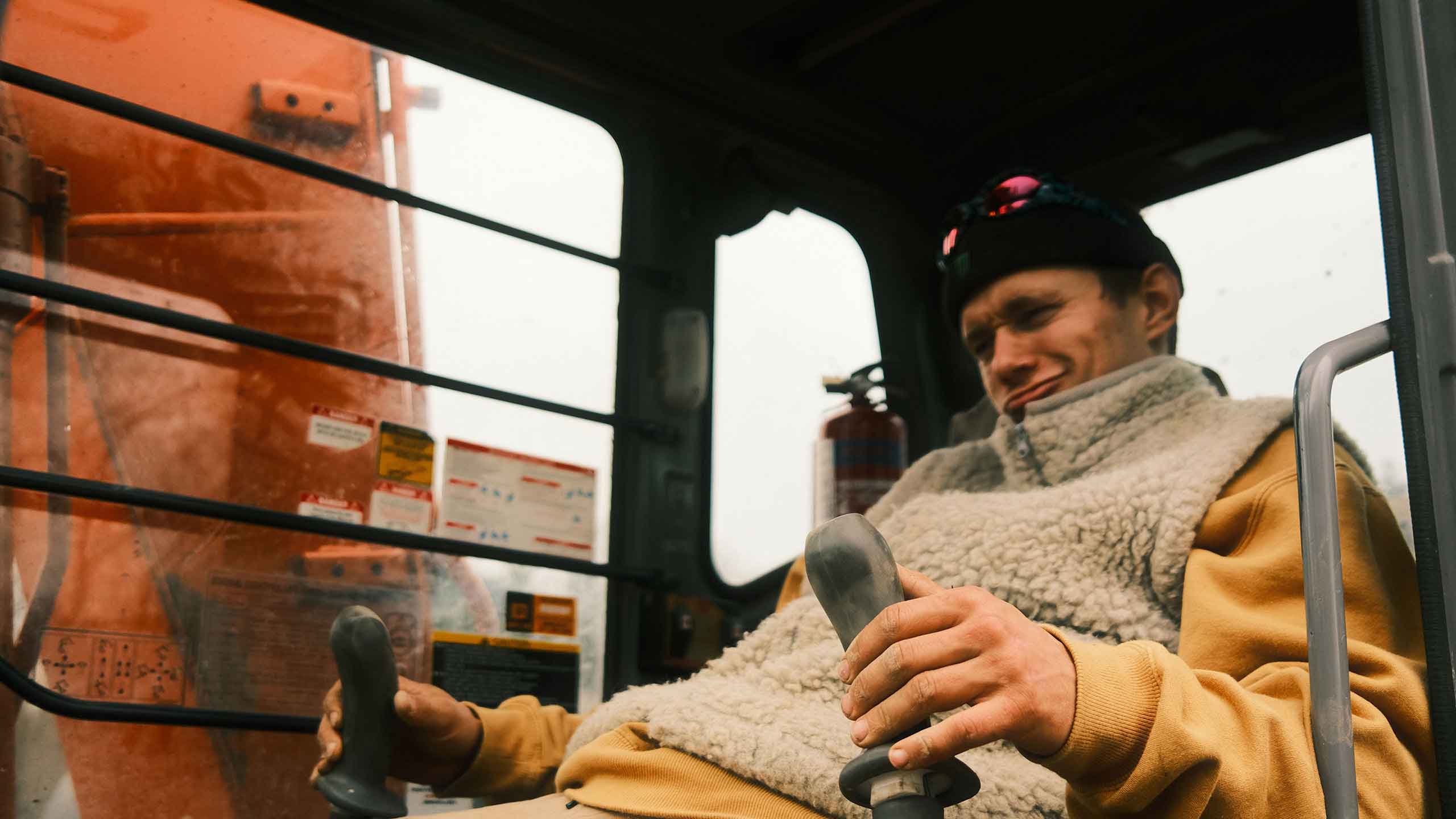 Sam sitting in a tractor